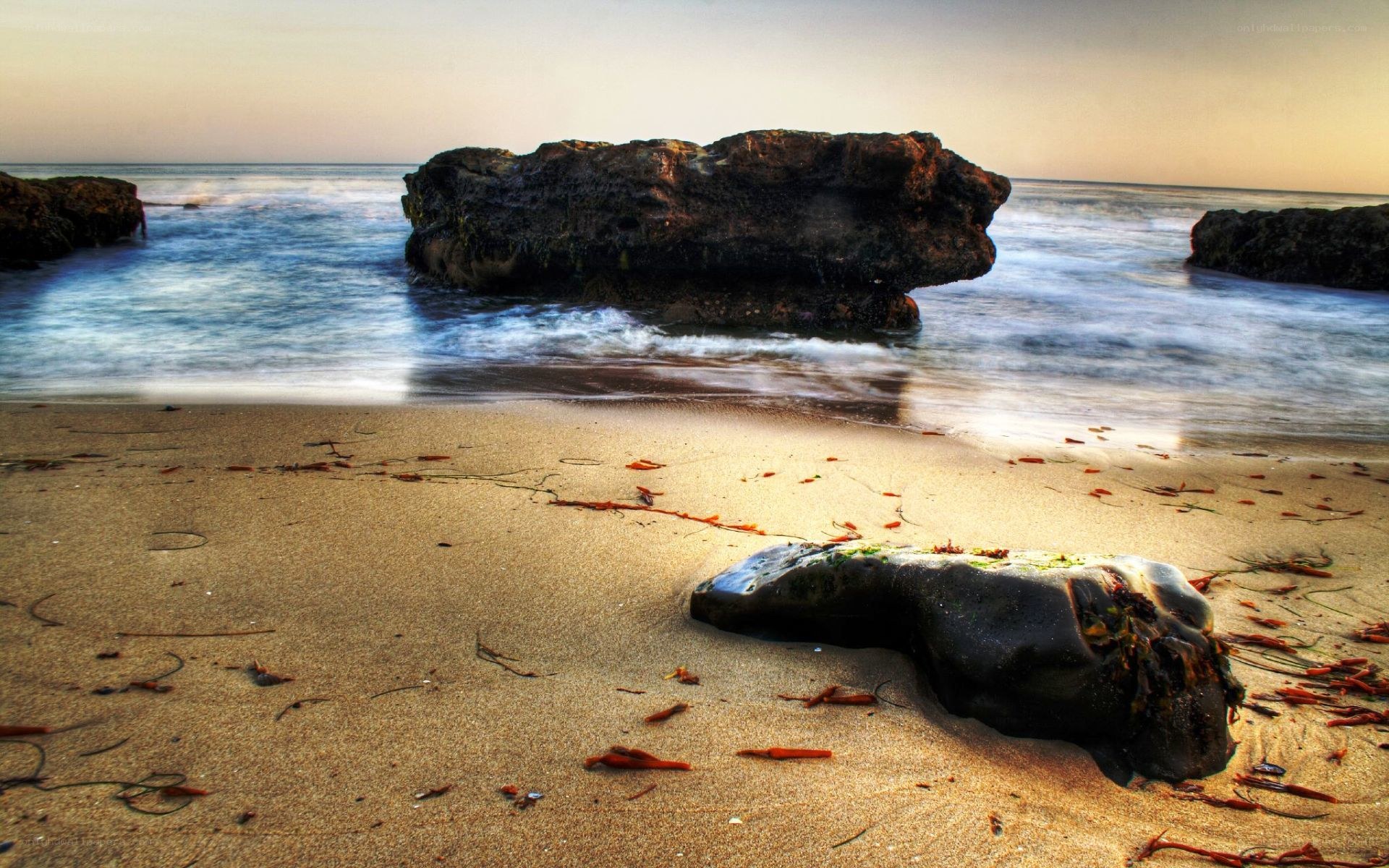 Beach with rocks at sunset