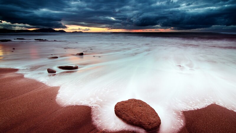Beach with Rocks at Sunset — Blue, Dramatic, Photograph