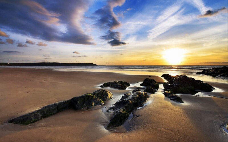 Beach with Rocks at Sunset — Blue