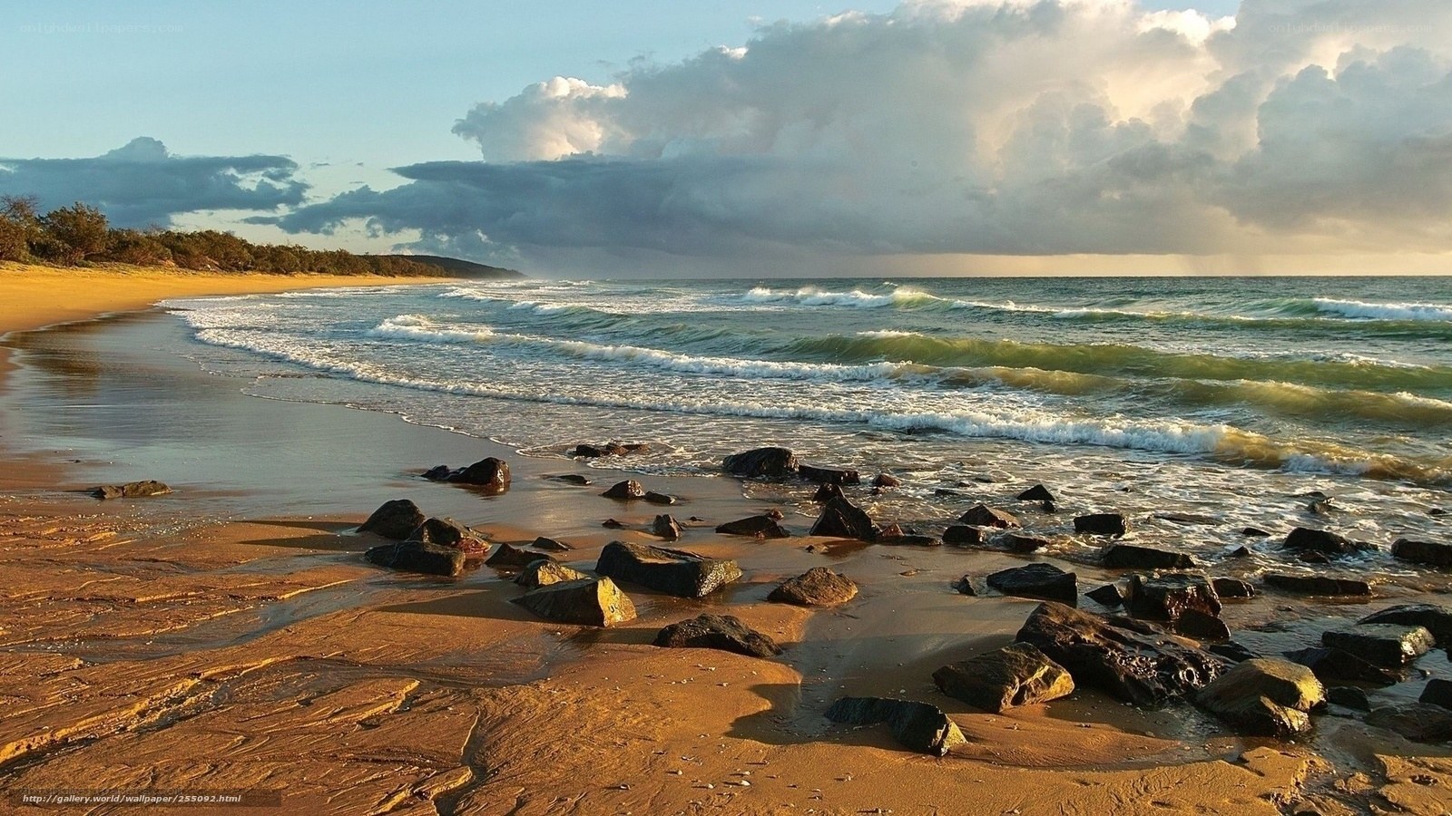 beach with rocks at sunset