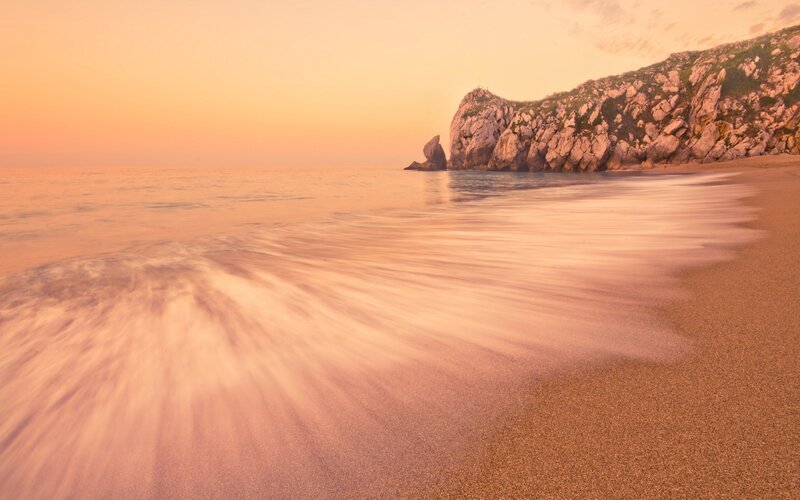 Beach with Rocky Cliff — Orange