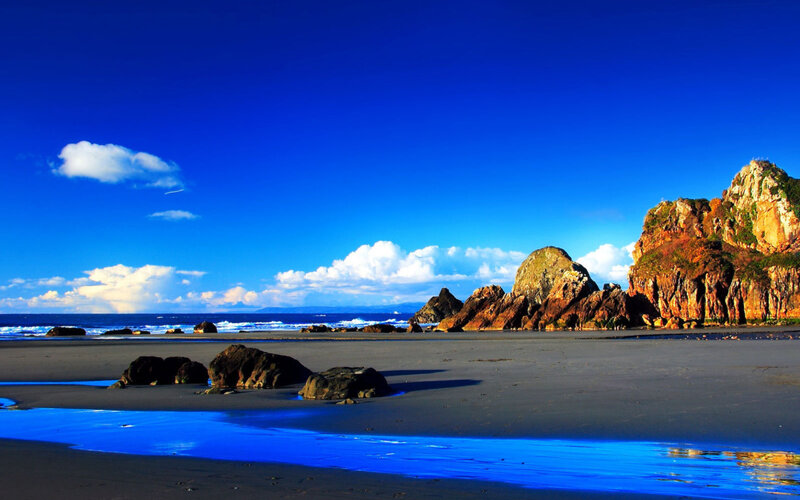 Beach with Rocky Cliffs — Blue, Serene, Afternoon, Photograph