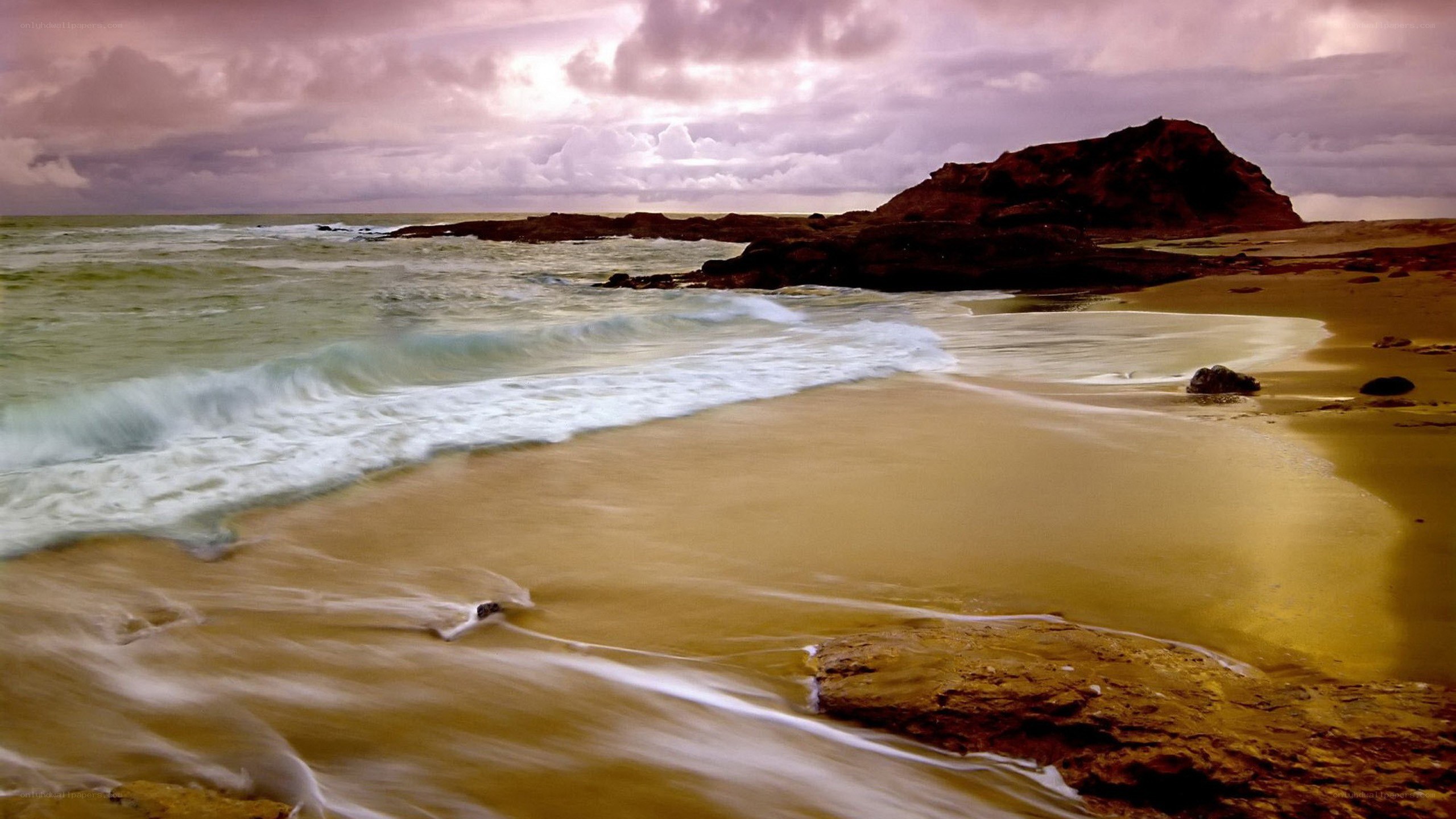 beach with rocky outcrop