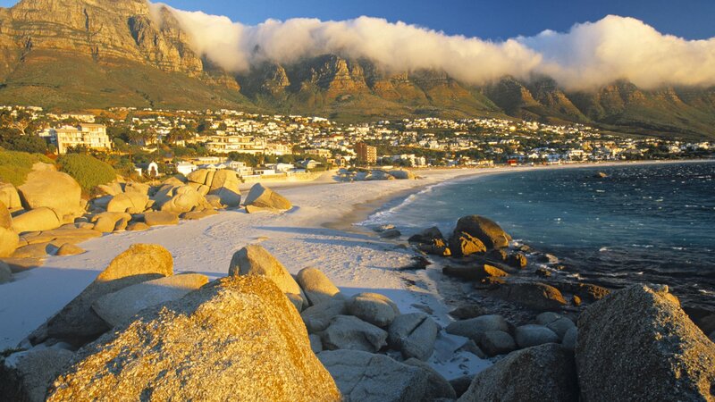 Beach with Rocky Shore — Blue, Serene, Sunset, Photograph, Mountains