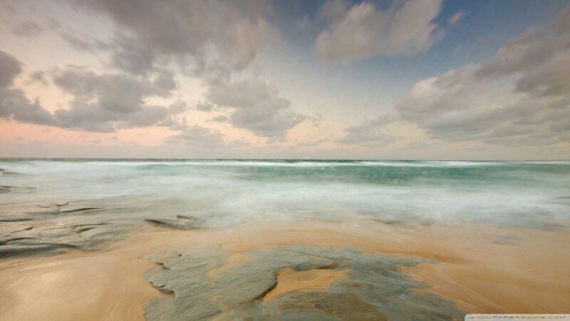 Beach with Rocky Shore — Blue, Serene, Sunset