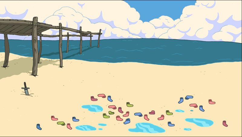 Beach with scattered boots