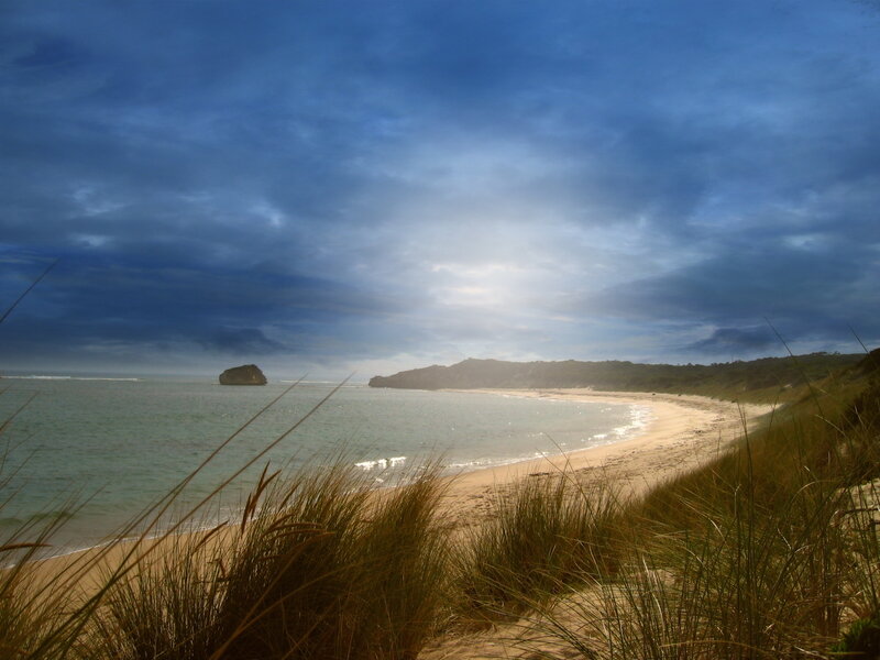 Beach with sea stack at dusk