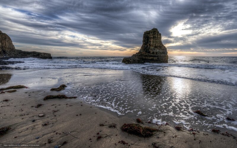 Beach with sea stack at sunset