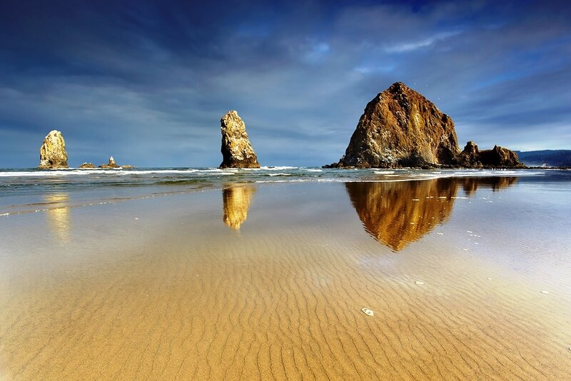 Beach with sea stacks and reflections