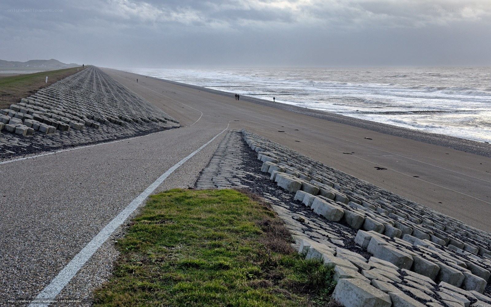 Beach with sea wall and road