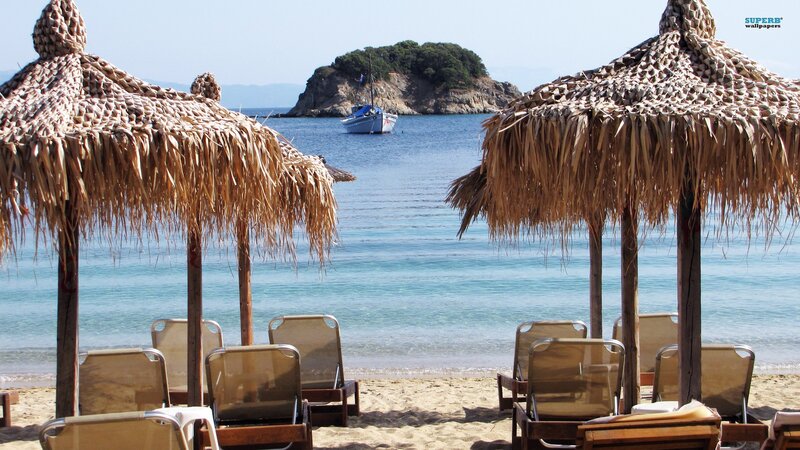 Beach with straw umbrellas