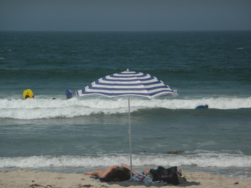 Beach with striped umbrella