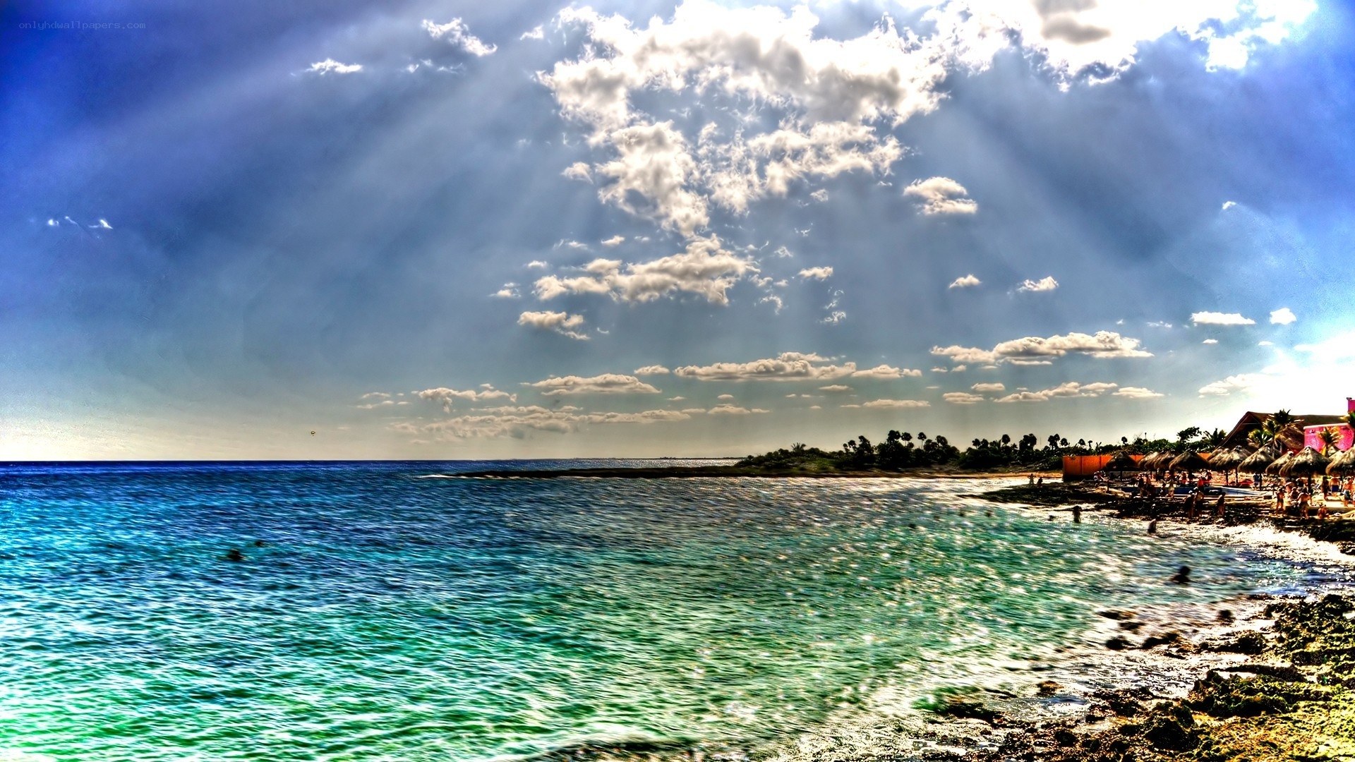 Beach with sunbeams and turquoise water