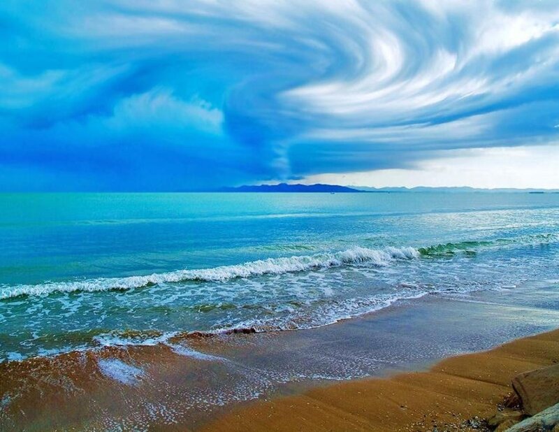 Beach with Swirling Clouds