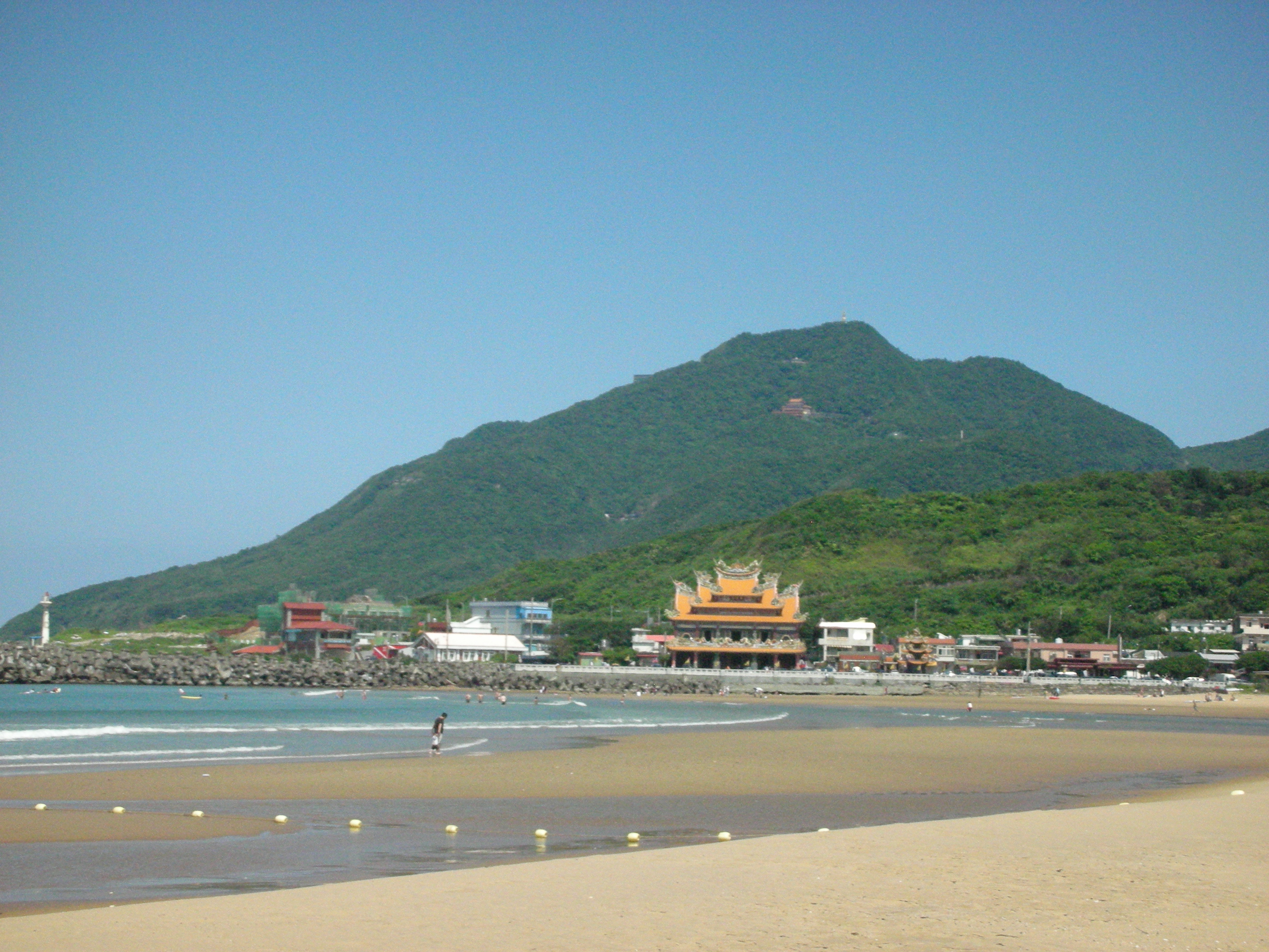Beach with temple and mountain