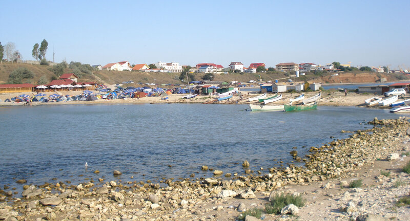 Beach with Tents and Boats