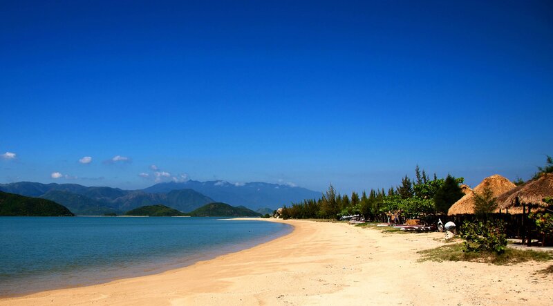 Beach with Thatched Huts — Blue, Serene