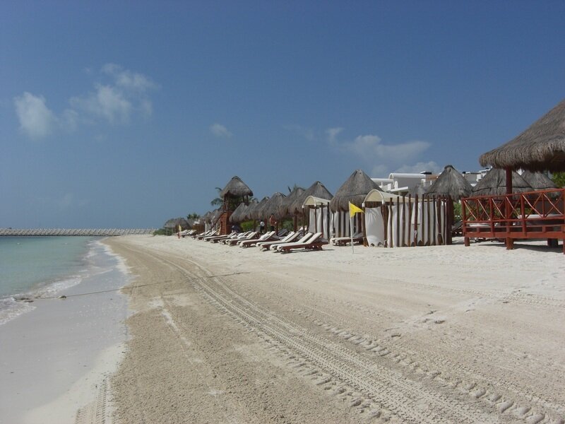 Beach with Thatched Huts — Blue