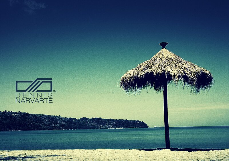 Beach with thatched umbrella