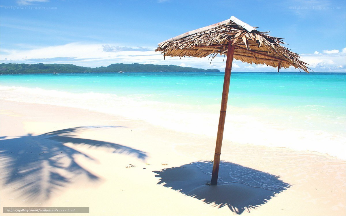 Beach with thatched umbrella
