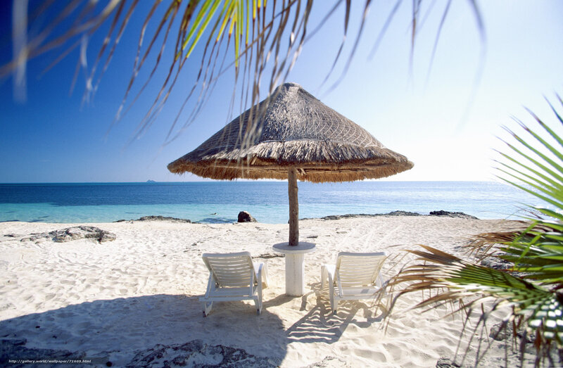 Beach with thatched umbrella