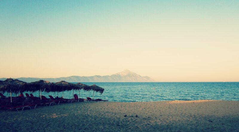 Beach with thatched umbrellas