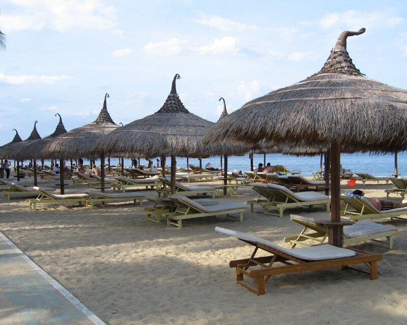 Beach with thatched umbrellas