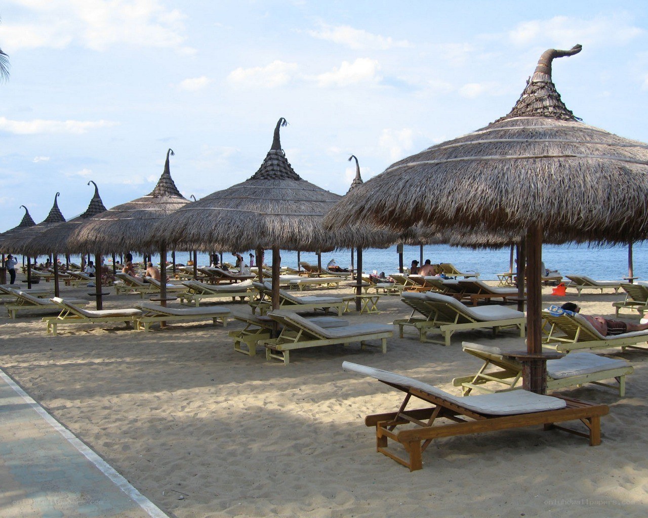 Beach with thatched umbrellas
