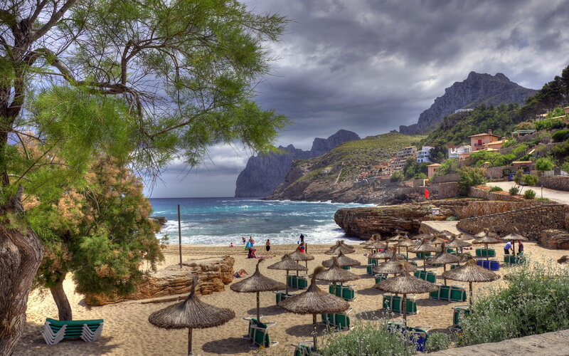 Beach with Thatched Umbrellas — Blue, Dramatic
