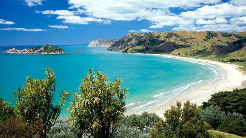 beach with turquoise water and hills