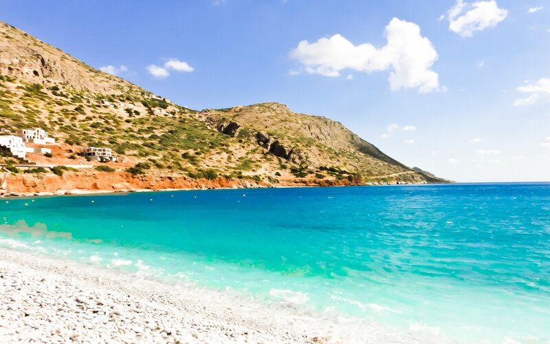 Beach with turquoise water and hills