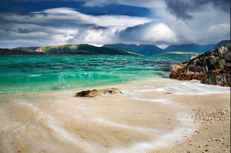 Beach with turquoise water and mountains
