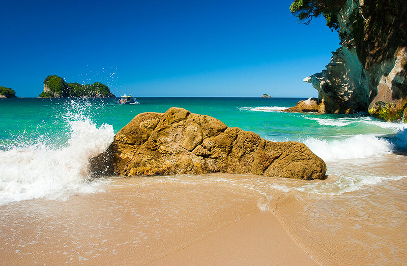 beach with turquoise water and rocks