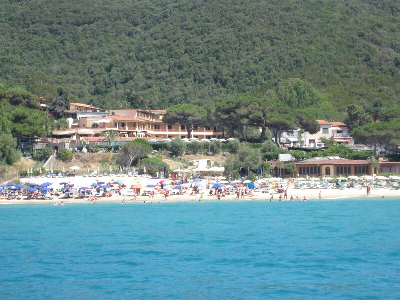 Beach with umbrellas and buildings