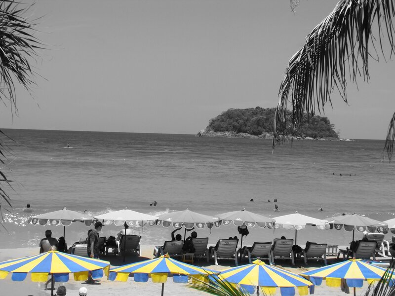 Beach with umbrellas and island