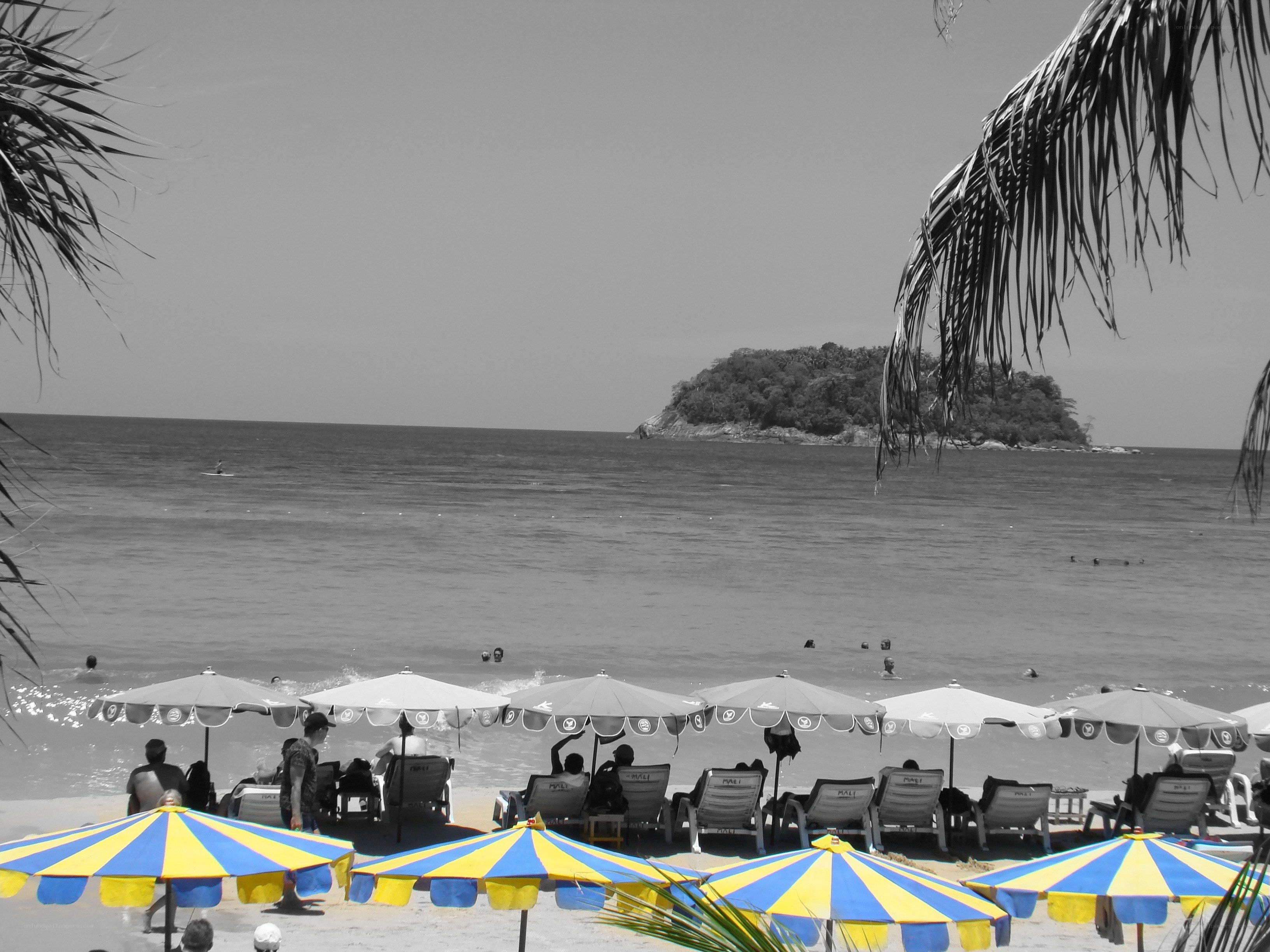 Beach with umbrellas and island