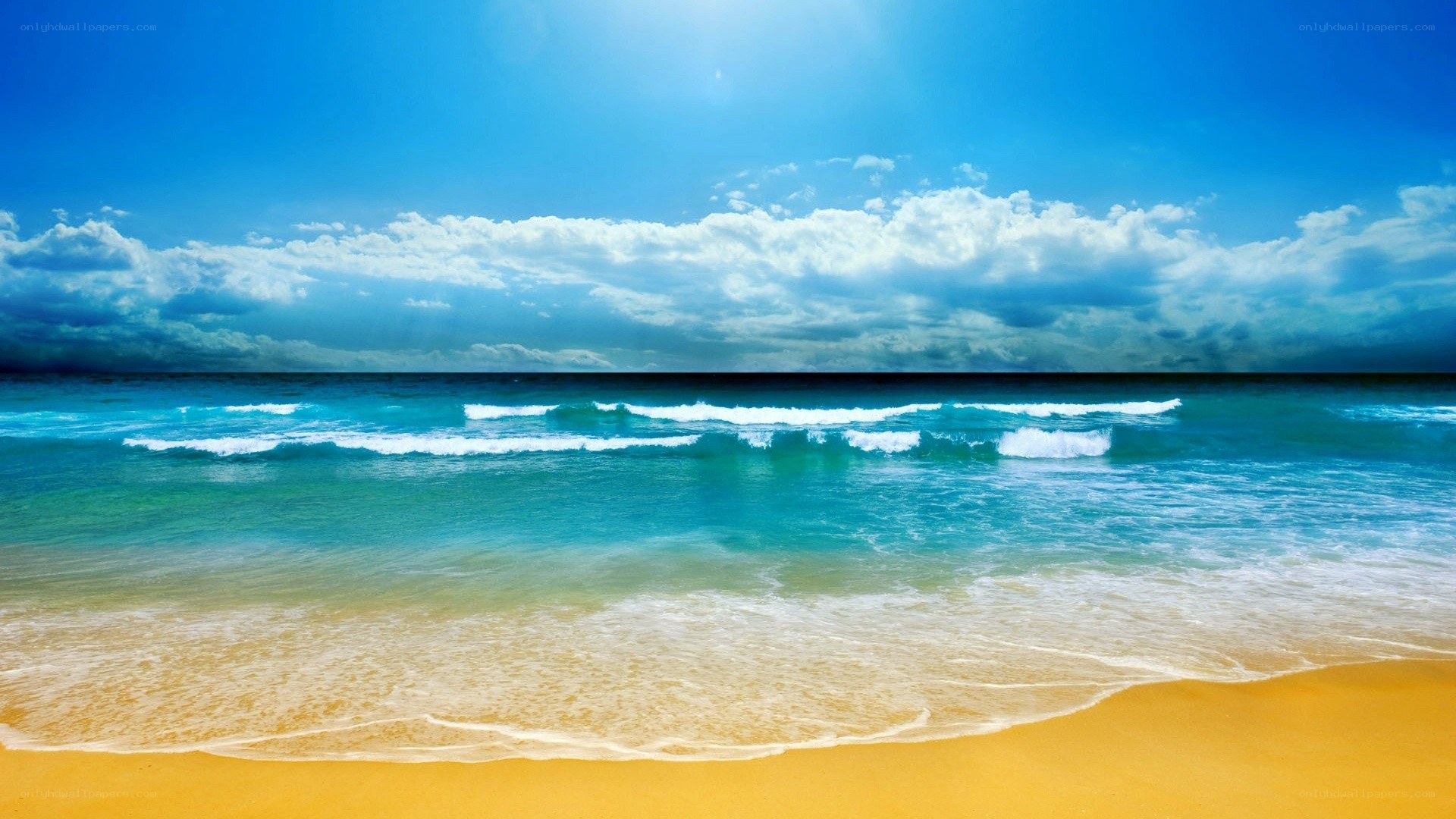 beach with waves and blue sky