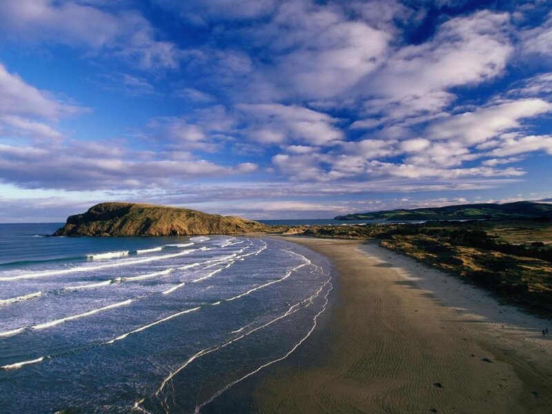 Beach with Waves and Cliff