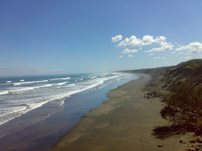 beach with waves and cliffs