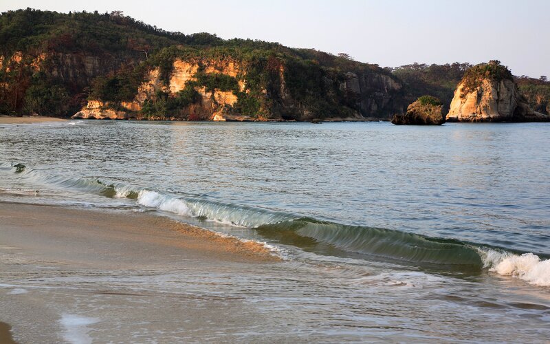 Beach with Waves and Cliffs — Blue, Serene, Sunset, Photograph