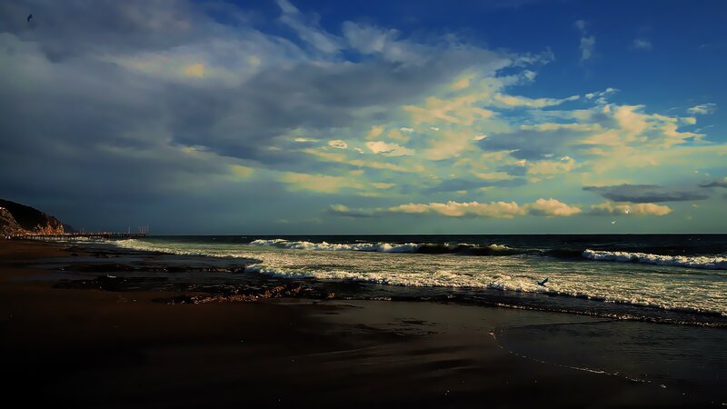 Beach with Waves and Pier
