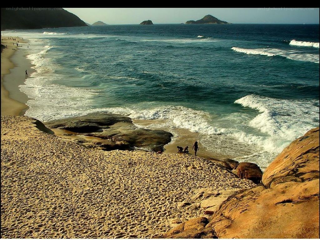 beach with waves and rocks