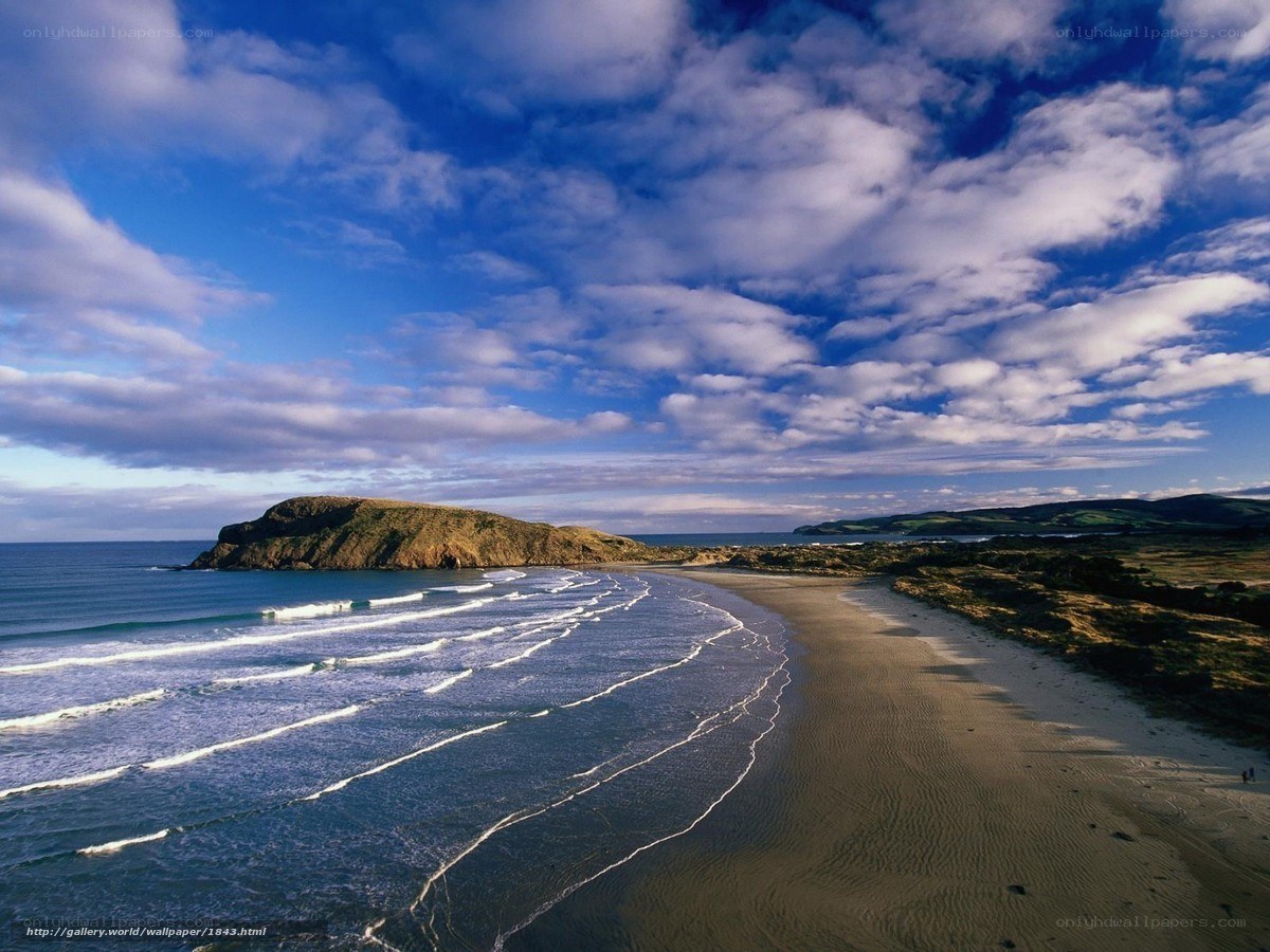 Beach with waves and rocky headland