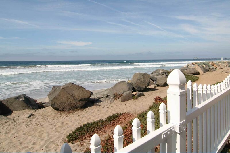 Beach with White Fence