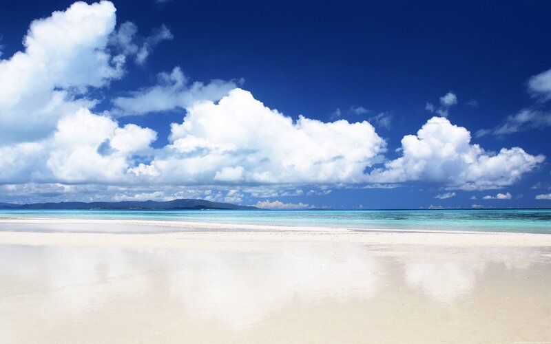 Beach with white sand and blue sky