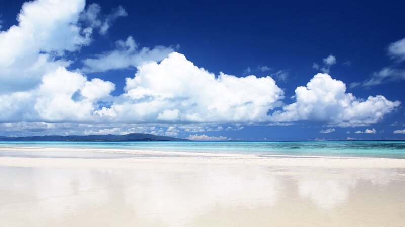 Beach with white sand and blue sky