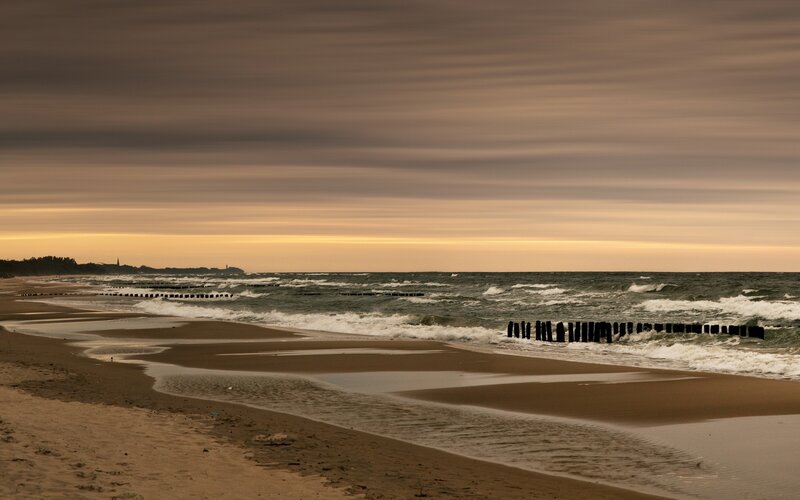 Beach with Wooden Groynes — Brown, Calm
