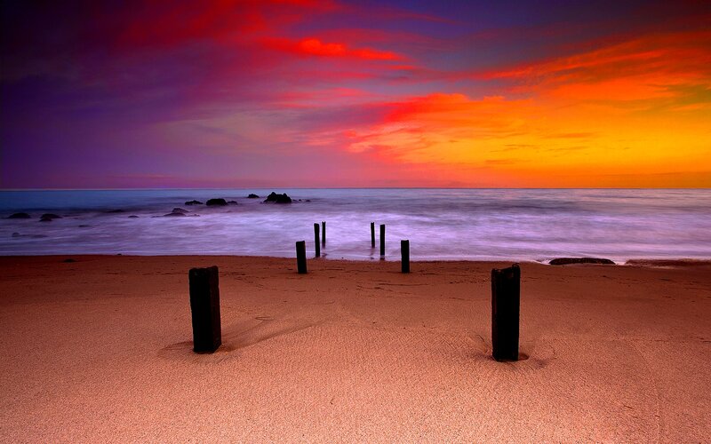 Beach with Wooden Posts — Red