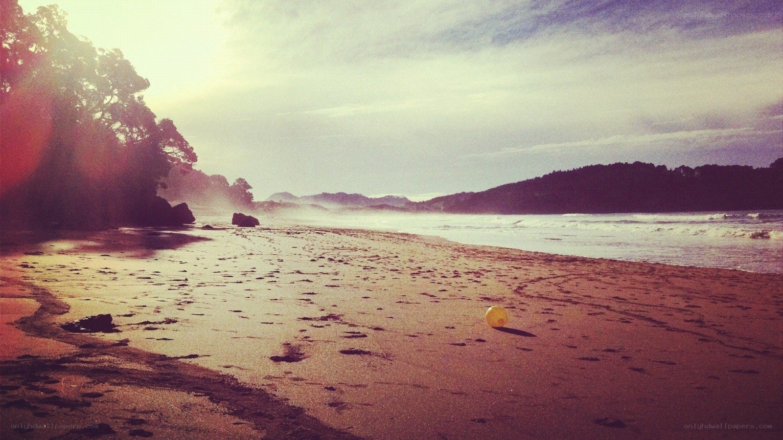 beach with yellow ball