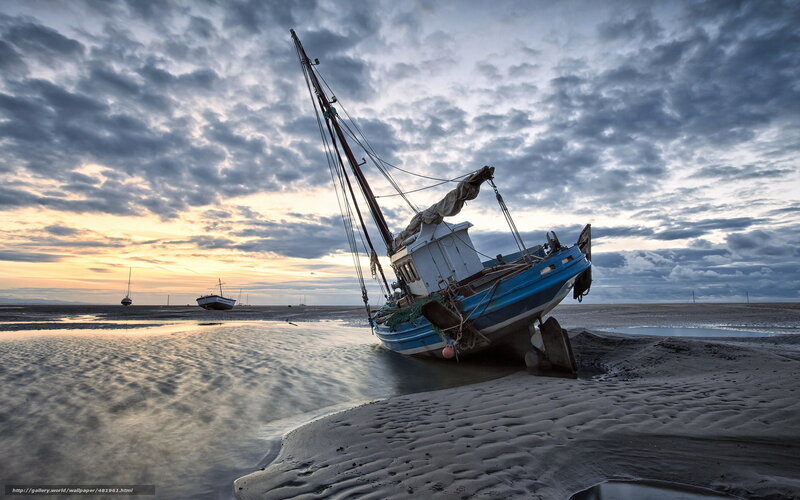 Beached boat at sunset